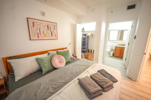 a bedroom with a large bed with towels on it at Orlando Blue Heron Beach Resort Renewed apartment in Orlando