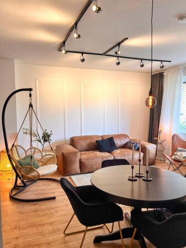 a living room with a couch and a table at SamaraS Place in Berlin