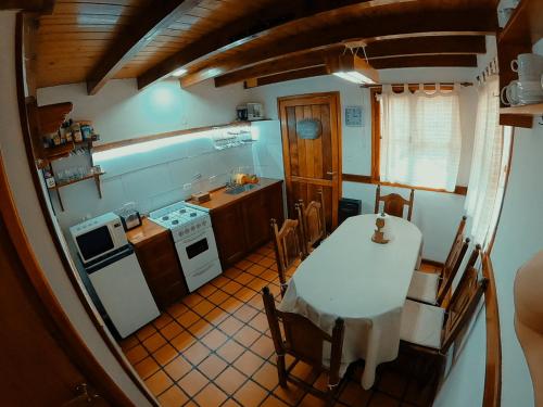 an overhead view of a kitchen with a table at Los Cerezos in San Martín de los Andes
