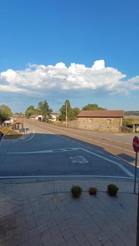 an empty street with a stop sign on a road at Casa Elisa Monegro. in Monegro