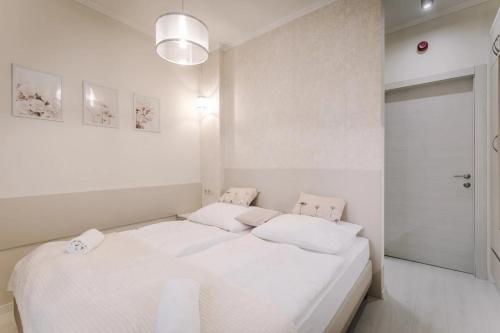 Кровать или кровати в номере Apartmanház Soho