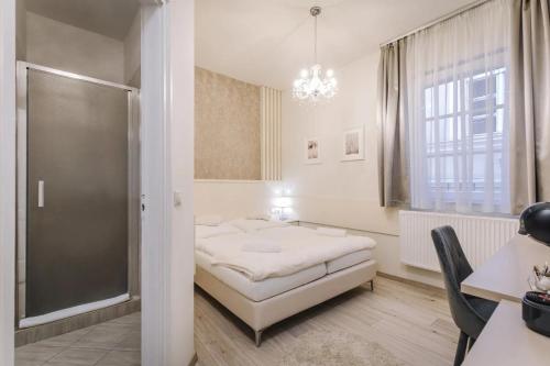 Кровать или кровати в номере Apartmanház Soho
