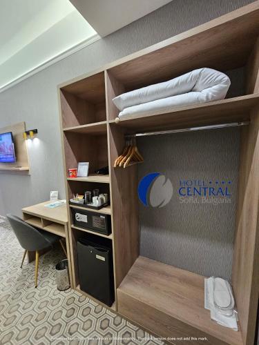 a bunk bed in a room with a desk at Central Hotel Sofia in Sofia