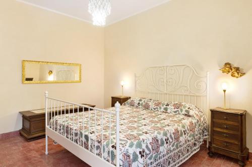 a bedroom with a bed and two night stands at Pratolina in Savona