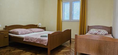 Ένα ή περισσότερα κρεβάτια σε δωμάτιο στο Adriatic Retreat: Apartmani Pazanin