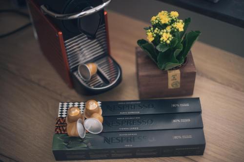 a table with two books and a vase with flowers at Novecento in Campobasso