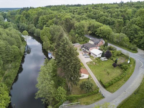 an aerial view of a house next to a river at Ferienhaus Eldeblick direkt am Eldeufer in Parchim in Parchim