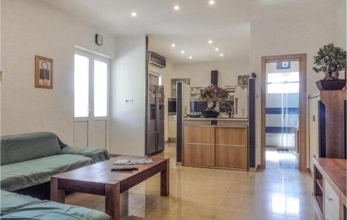 a living room with a couch and a table at 1 Bedroom Beautiful Apartment In Cavtat in Cavtat