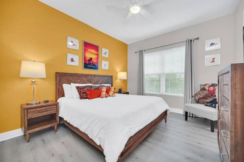 a bedroom with a large bed and a window at Magical Residence Resort, 5 min Disney in Orlando
