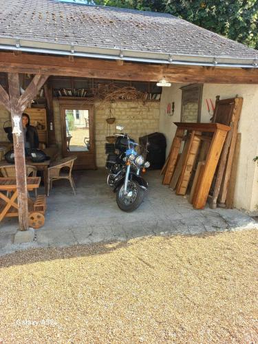 a motorcycle parked in front of a building at La douceur Saumuroise avec petit déjeuner in Saumur