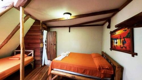 a bedroom with two bunk beds in a house at Se Ua in Manzanillo
