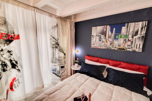 Ένα ή περισσότερα κρεβάτια σε δωμάτιο στο Marco Polo B&B