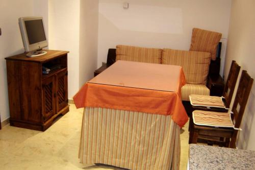 Giường trong phòng chung tại Casa Mamica Rosario