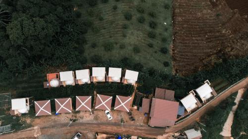an overhead view of a group of buildings on a road at ม่อนชาพาเพลิน ม่อนแจ่ม Monchapaplearn Monjam in Mon Jam