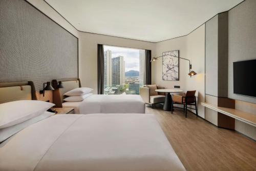 Postel nebo postele na pokoji v ubytování Sheraton Taizhou