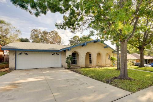 a house with a white garage and a tree at San Antonio Home Near Nature, Parks and Trails in San Antonio