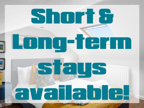 a bedroom with a bed with the words short long term stays available at 2BR Home In Barrow-in-Furness Sleeps 8 close to BAE Systems, Hospital, Lakes in Barrow in Furness