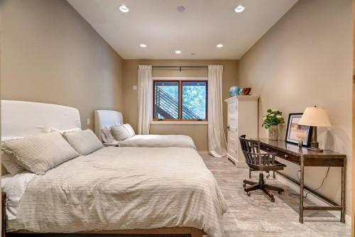 a bedroom with a bed and a desk and a desk at The Chic Cabin Apartment in Flagstaff