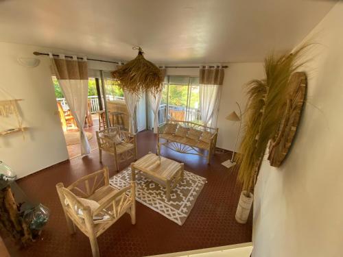 an aerial view of a living room with chairs and a table at DIAMANT CHERRY in Le Diamant