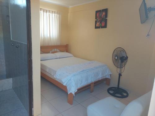 Una cama o camas en una habitación de R. A. C. S.