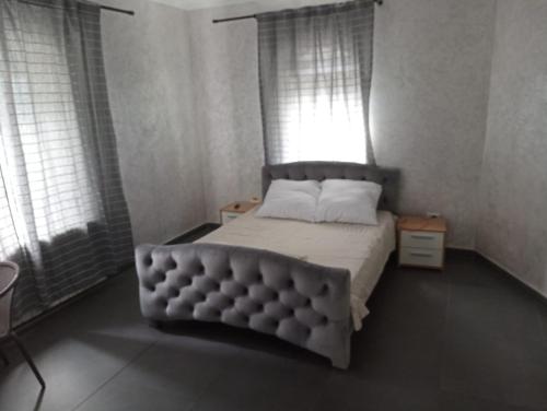 Кровать или кровати в номере Cataleya Caffee