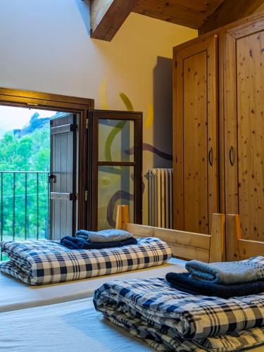 Ένα ή περισσότερα κρεβάτια σε δωμάτιο στο Rifugio Aleve