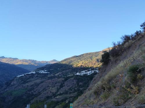 a view of a mountain with snow on it at Casa Las Alacenas, Bubión (La Alpujarra, Granada) in Bubión