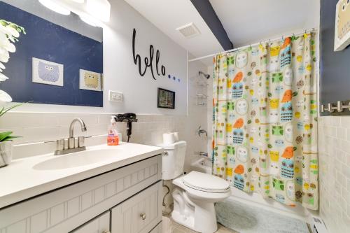 a bathroom with a toilet and a shower curtain at 5 Mi to Tobyhanna State Park Home with Game Room! in Tobyhanna