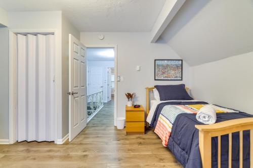 a bedroom with a bed and a staircase at 5 Mi to Tobyhanna State Park Home with Game Room! in Tobyhanna