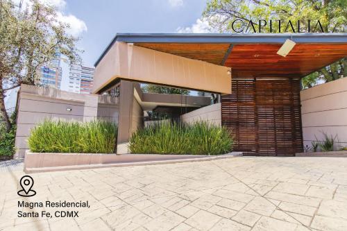 a building with a pavilion in a city at Capitalia - Apartments - Santa Fe in Mexico City