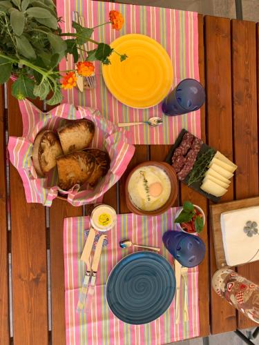 a table with plates of food on a picnic table at La Casa di Toni in Pescara