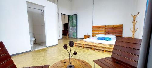 a bedroom with a bed in the middle of a room at Suíte Senhor de Engenho in Nova Lima