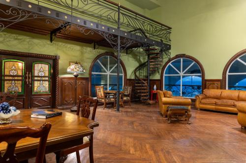 a large living room with a table and chairs at Gamboa Rainforest Reserve in Gamboa