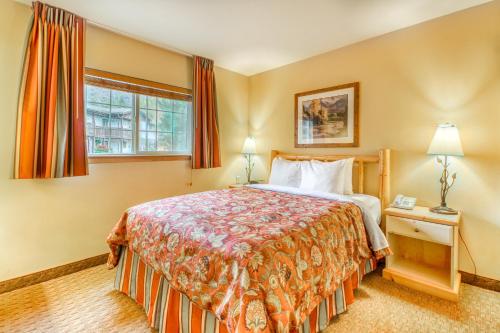 a hotel room with a bed and a window at Icicle Village Resort 401 Aspen Abode in Leavenworth