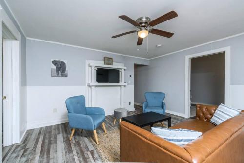 a living room with a couch and two chairs at Renovated 3 bedroom close to downtown! in Durham