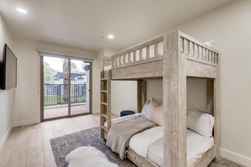 a bedroom with a bunk bed and a large window at Parkway Paradise in Scottsdale