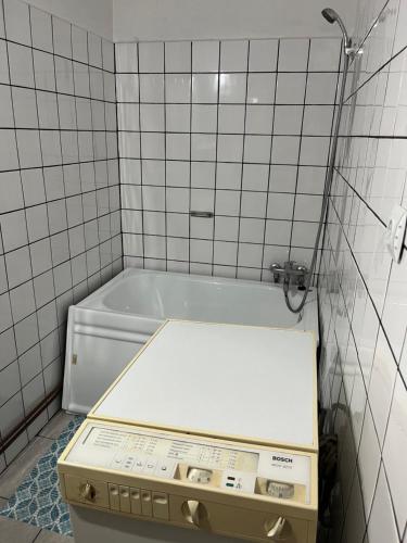 a bath tub with a box in a bathroom at CASA LUCIAN in Cârțișoara