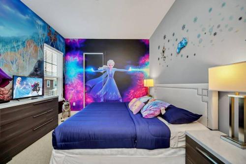 a bedroom with a blue bed with a painting on the wall at NEW awesome dream house, 5 Min to Disney in Orlando