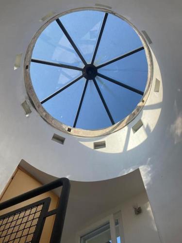 a large window in the ceiling of a building at Dimora Mirtilla - alloggio, max 4 posti letto. in Petacciato