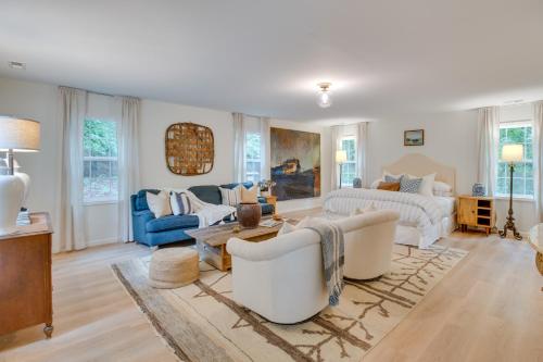 a living room with two couches and a table at Idyllic Cave Spring Studio with Patio and Fire Pit! in Cave Spring