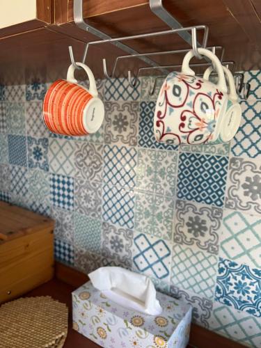 a room with blue and white tiles on the wall at Casa al mare in Scauri