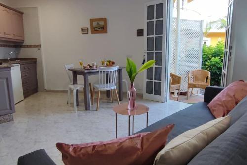 a living room with a couch and a table at Finca de Sal in Villa de Mazo