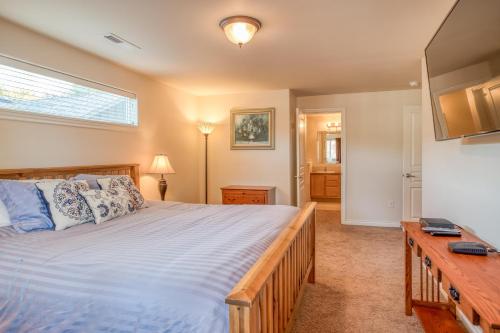 a bedroom with a large bed and a window at The Osprey - Meredith Lodging in Bend