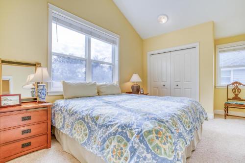 a bedroom with a bed and a dresser and a window at Ocean Gem in Lincoln City