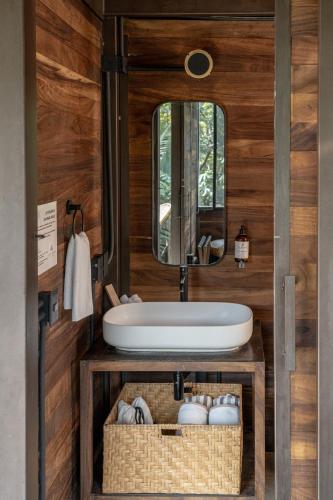 a bathroom with a sink and a mirror at Casa Selva Sayulita in Sayulita