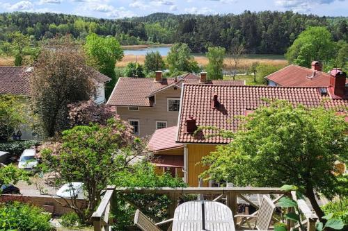 arial view of a house with trees and buildings at Outstanding apartment close to Gothenburg in Kungälv