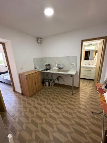 a kitchen with a sink and a counter top at Progon House in Tepelenë