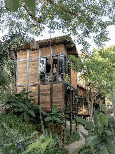 a tree house in the middle of a forest at Casa Selva Sayulita in Sayulita