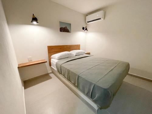 Ένα ή περισσότερα κρεβάτια σε δωμάτιο στο Rooms Huatulco