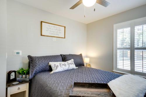 a bedroom with a bed and a ceiling fan at Step-Free Home with Fire Pit - 3 Miles to USC! in Columbia